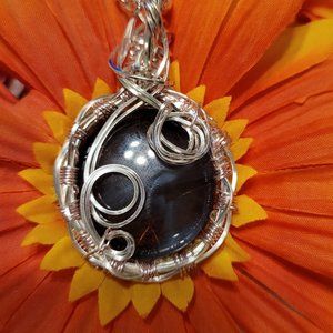 Silver wrapped purple pendent with 24 inch silver chain necklaceThe 1.25 inch li